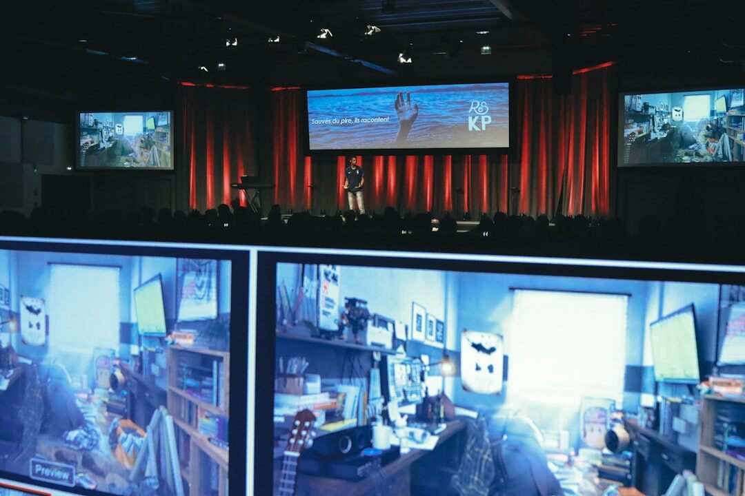 Broadcast control room with multiple video monitors showing news feeds
